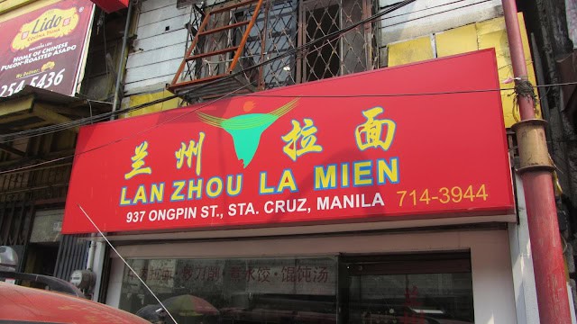 Rich hot beef soup bowl with hand-pulled noodles at Lan Zhou La Mien